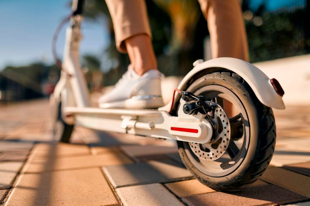 Business lady riding scooter